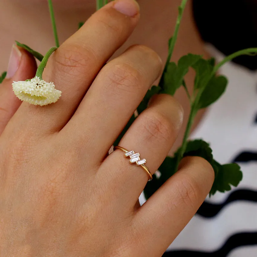 Four Baguette Cut Diamonds Set In A Tilted Composition - Vintage Ring