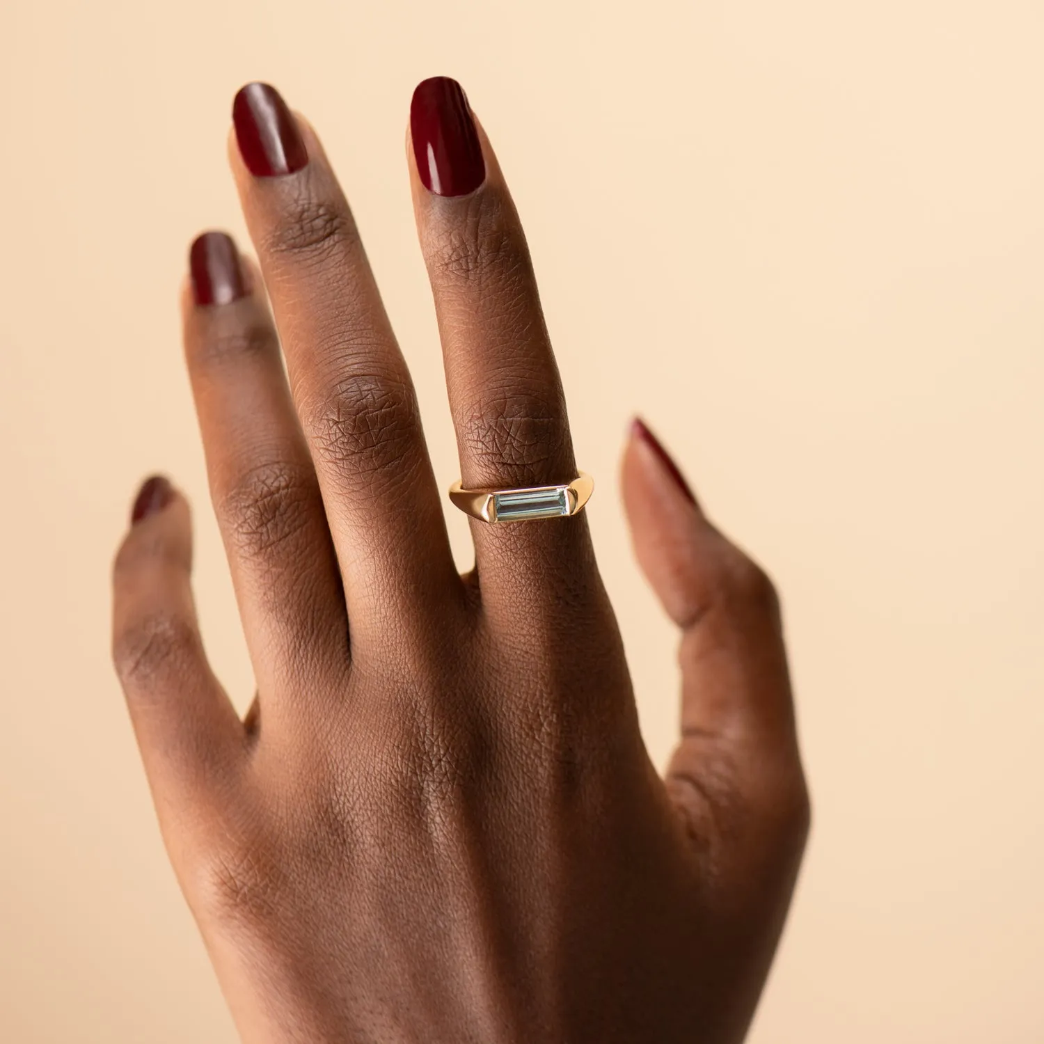 Modern Solitaire Ring with a Baguette Cut Aquamarine